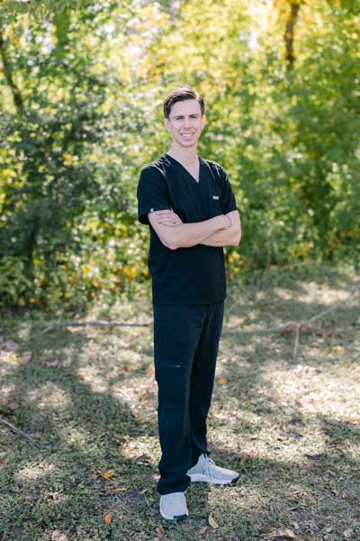 Dr. Jason Larsen at Parkside Dental wearing black scrubs
