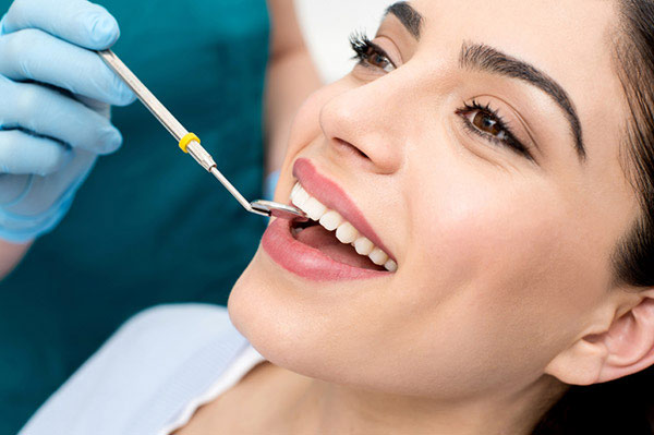 A woman getting a dental exam