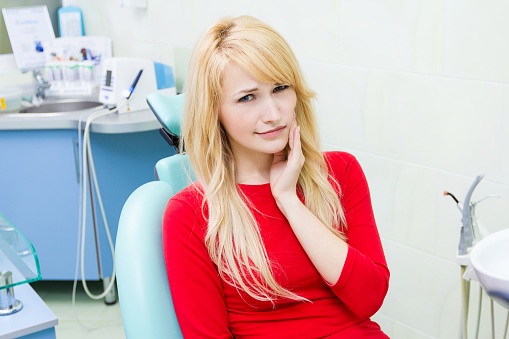  Patient holding jaw before appointment at Parkside Dental in Murphy, TX 