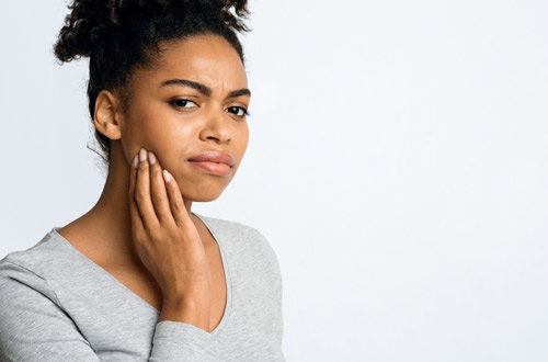 A woman getting ready to have her tooth extracted